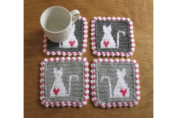 white cat coasters