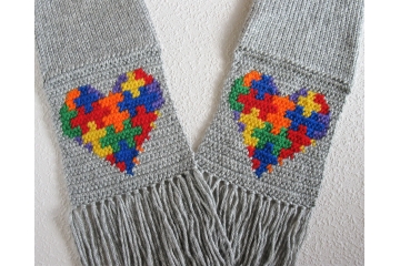 Autism awareness scarf.  Gray knit with crocheted puzzle piece hearts