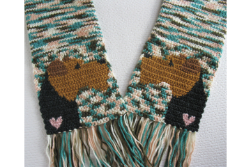 Airedale Terrier Scarf. Multicolor knit scarf with Welsh terriers and small pink hearts.